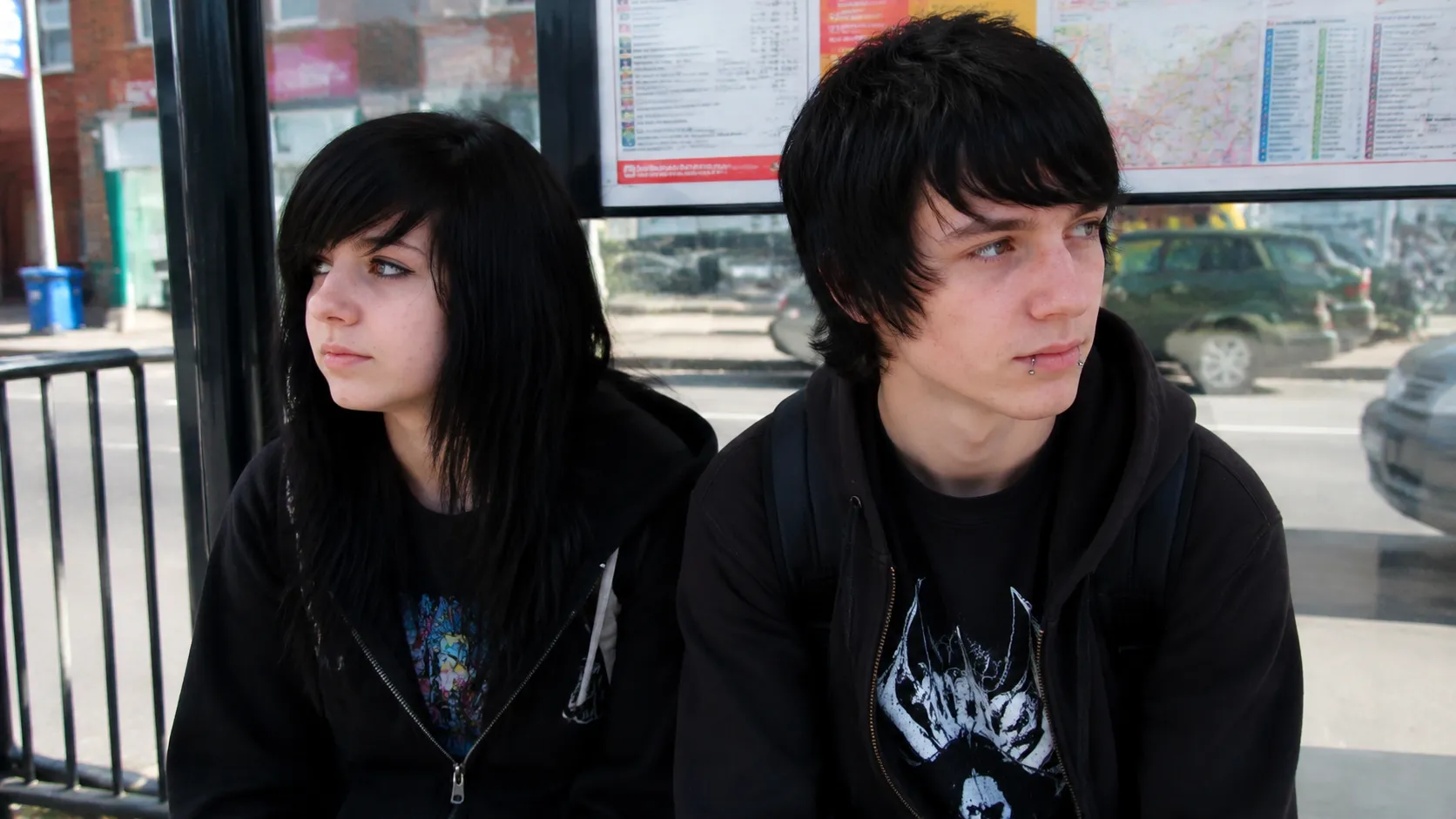 White Teenagers With Caramel Brown Hair Studying At Outdoor Cafe